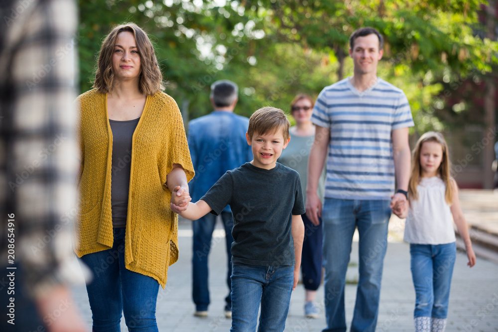 Family of different ages walk in the park