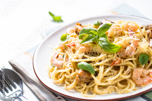 Pasta spaghetti with seafood and cream sauce.