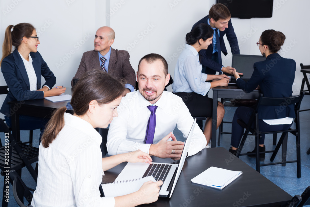 Fototapeta premium Employees having a productive day at work