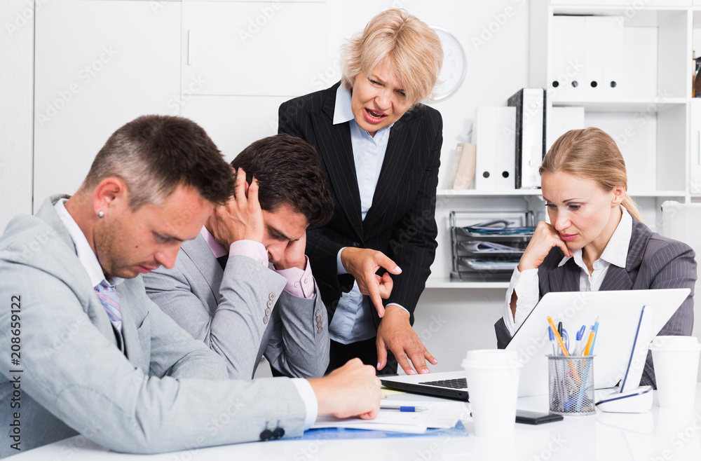 Fototapeta premium Female manager expressing dissatisfaction with teamwork