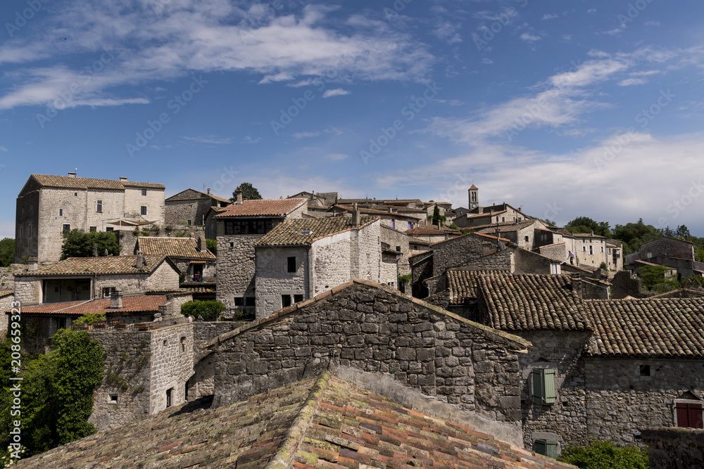 view over the roofes of the city balazuc in france