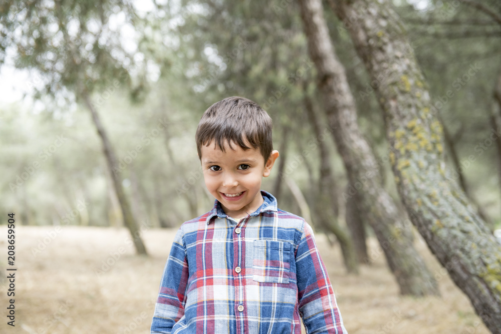 Handsome little boy posing in the park Handsome little boy posing in the park