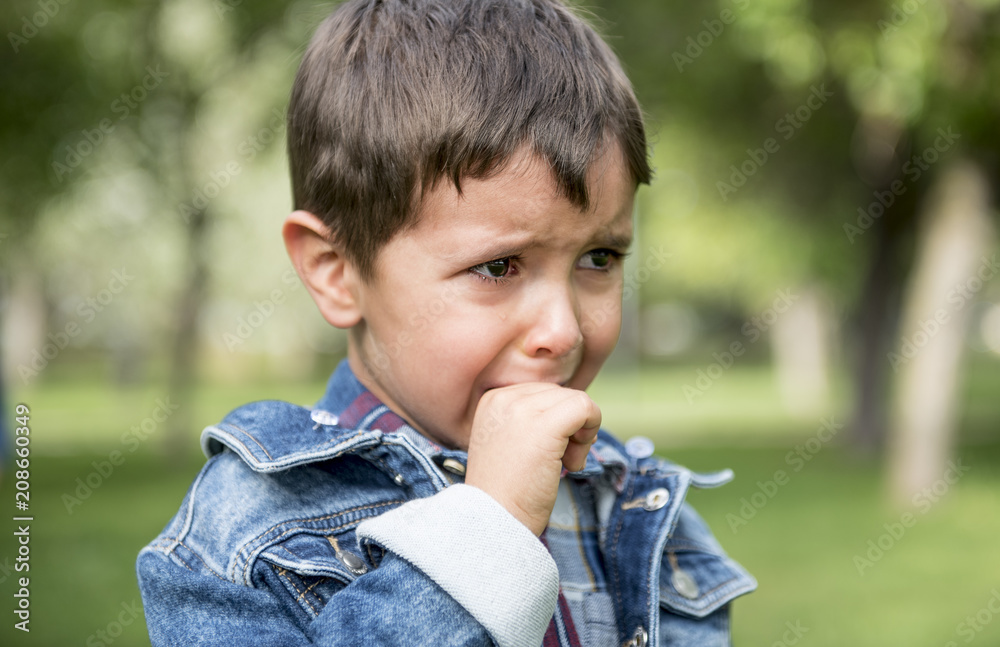 Handsome little boy posing in the park Handsome little boy posing in the park