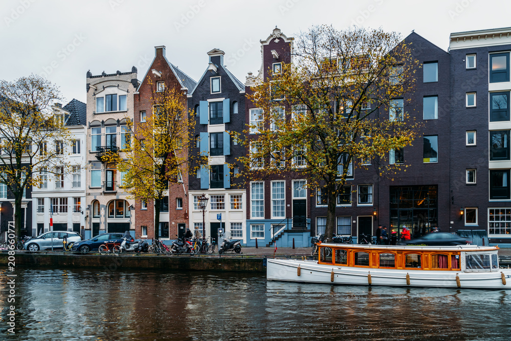 Naklejka premium Architecture Of Dutch Houses Facade and Houseboats On Amsterdam Canal