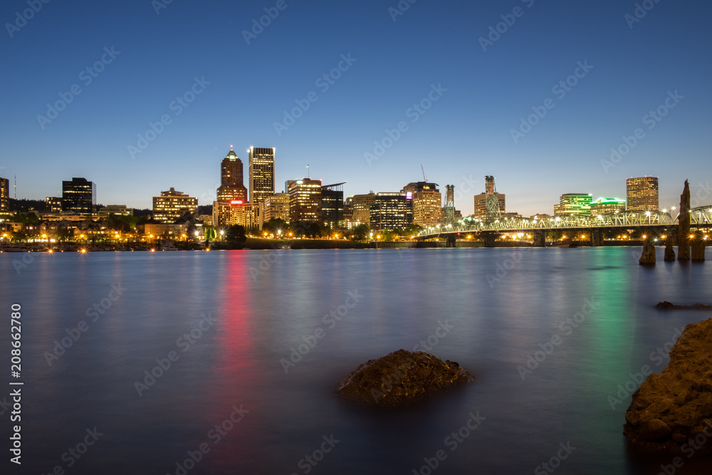 Waterfront city skyline at night