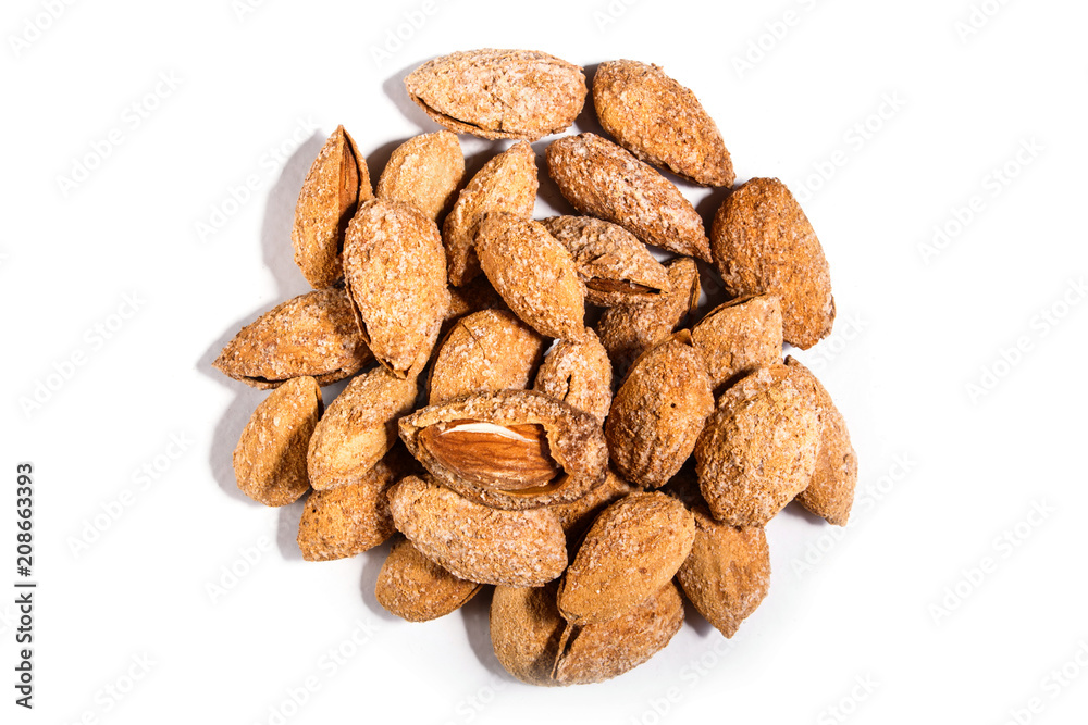 Pile of sweet almond nut with shell and salt isolated on white background. Pile of sweet almond nut with shell and salt isolated on white background.