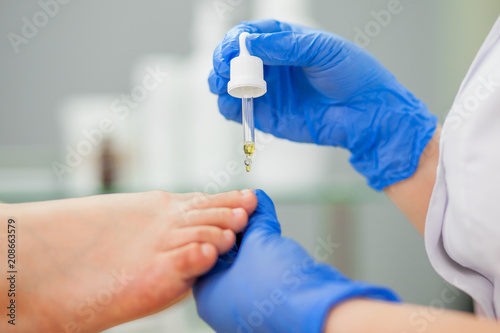 podiatrist treats foot. photo
