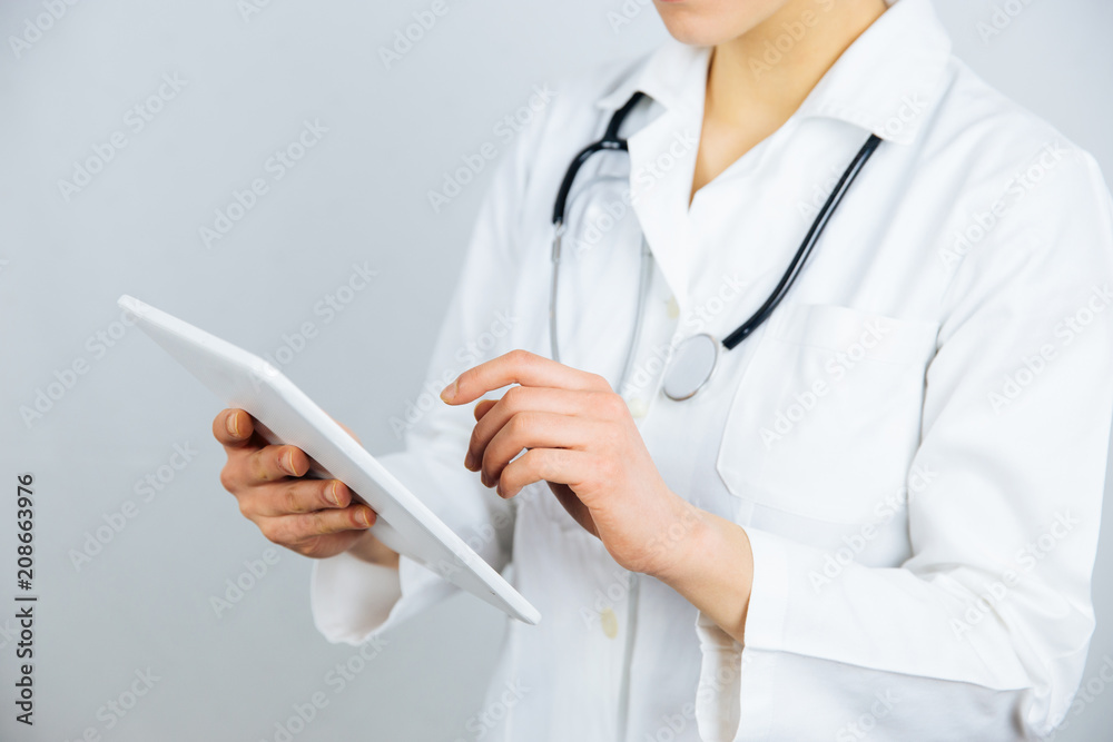Female doctor work on digital tablet. Female doctor work on digital tablet.