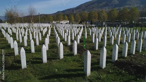 Panning aerial view of graves of murdered men and boys during Srebrenica genocide in Bosnia and Herzegovina photo