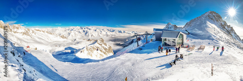 Stunning winter panorama in Tonale ski resort. View of Italian Alps from Adamelo Glacier, Italia, Europe