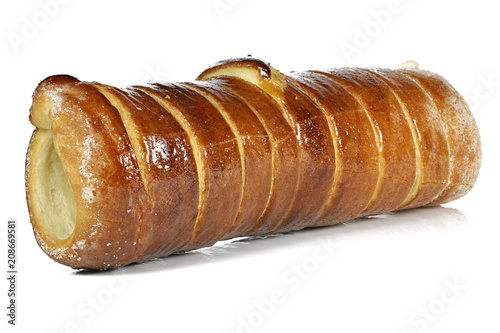 Baumstriezel (spit cake) isolated on white background photo