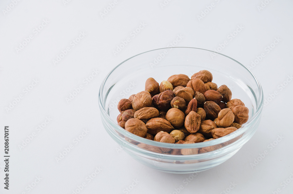 Hazelnuts in a glass bowl Hazelnuts in a glass bowl