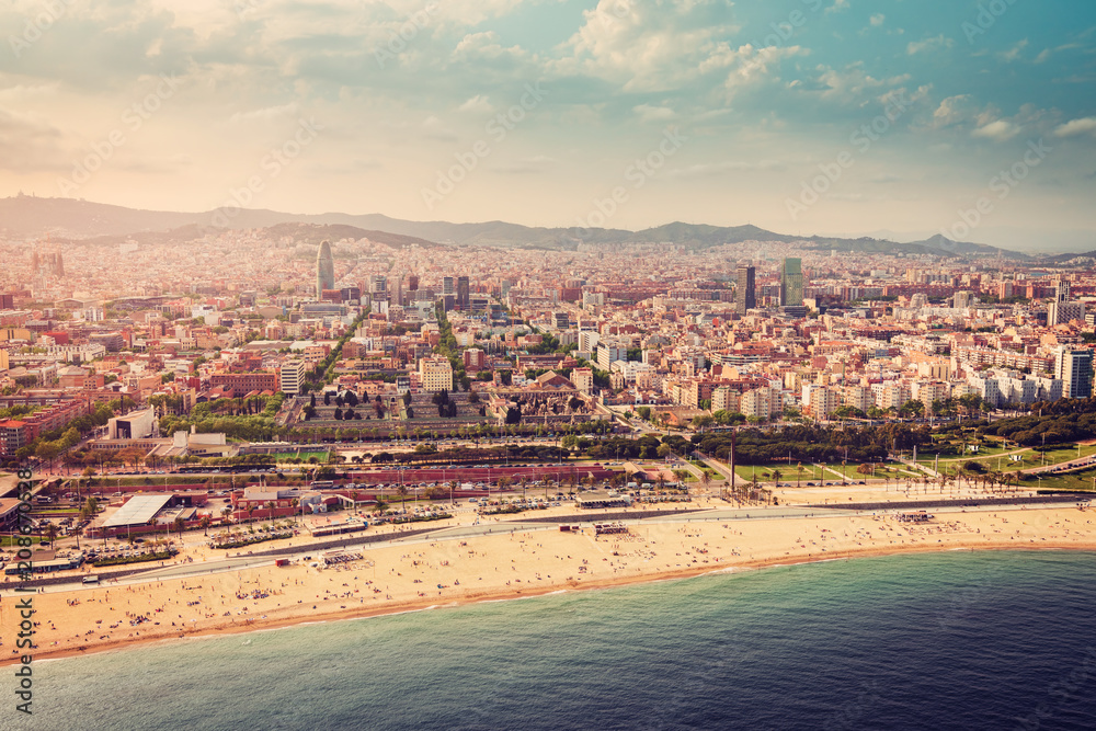 Barcelona skyline aerial view with the beach, Spain. Vintage colors