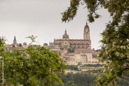 viewpoint of Segovia. Gothic cathedral, Romanesque churches, aqueduct. Segovia skyline in spring, gray sky. Spain. Europe