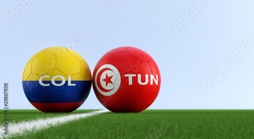 Colombia vs. Tunisia Soccer Match - Soccer balls in Colombia and Tunisia national colors on a soccer field. Copy space on the right side - 3D Rendering 