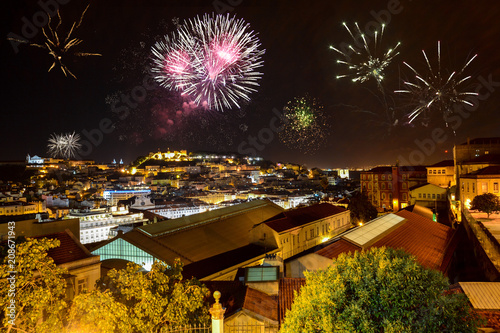 Photography Lisbon at night with fireworks: View from Miradouro Bairro Alto to the castle Ca