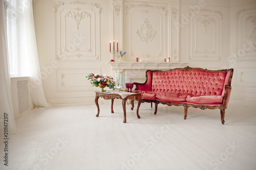 Photography baroque style interior with red luxury sofa and table in the middle