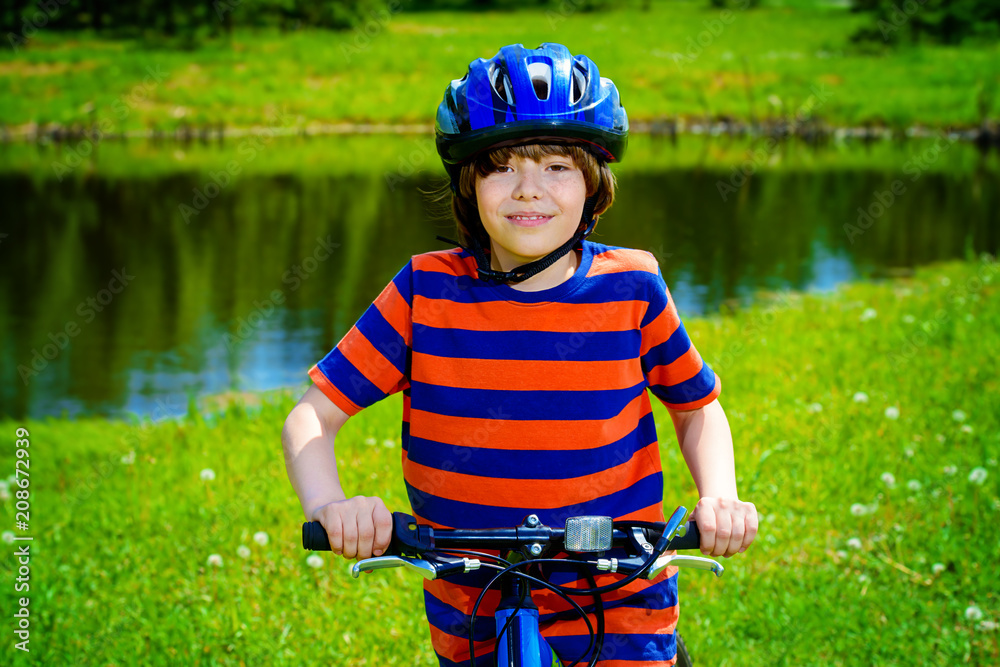 boy is riding his bike boy is riding his bike
