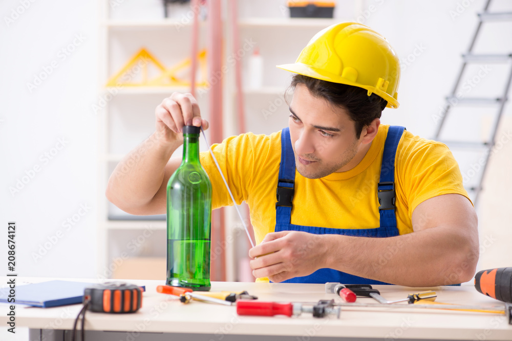 Drunk engineer working in the workshop