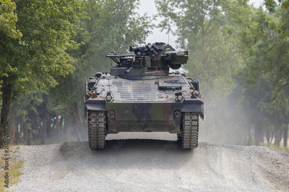 Fototapeta premium German infantry fighting vehicle drives on a road