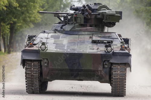 Fototapet German infantry fighting vehicle drives on a road