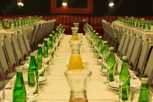 banquet hall with soft focus drinks juice and water bottles 