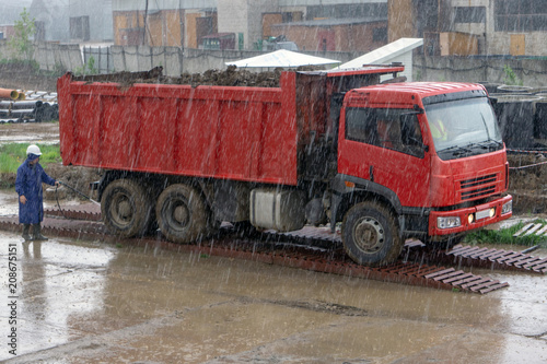 the washer washes the car under rain