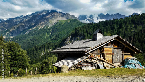 Small wooden cabin in the alps mountains