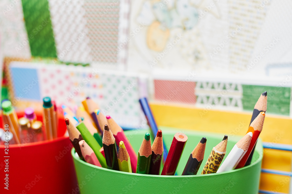 Fototapeta premium Colour pencils in a green cup