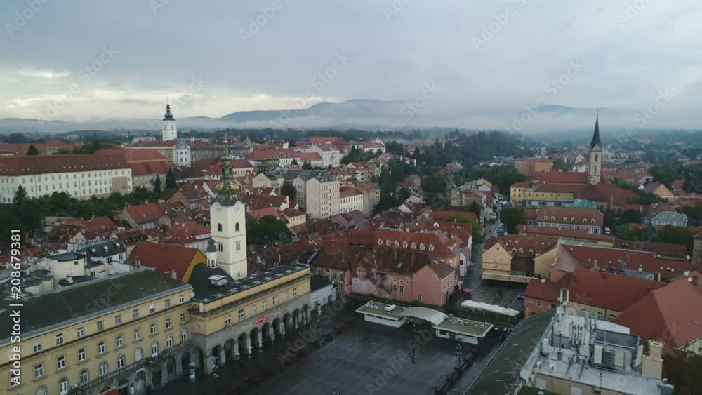 Beautiful drone flight over historic center of Zagreb on a misty day, mountain scenery in the background Beautiful drone flight over historic center of Zagreb on a misty day, mountain scenery in the background
