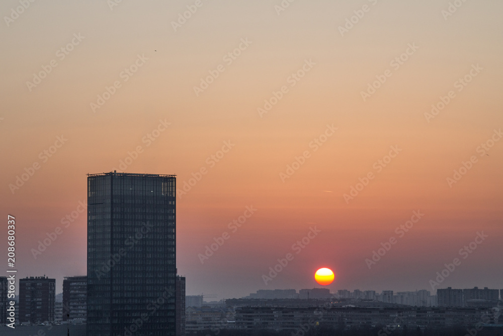 Skyline of New Belgrade (Novi Beograd) seen during sunset from the Kalemegdan fortress. The main landmark of the district, Usce, a symbol of the socialist brutalist architecture, can be seen