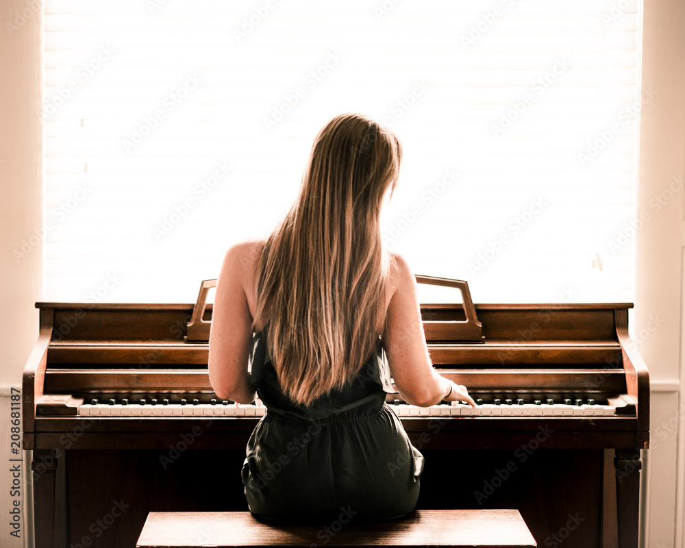 Woman Girl Playing Piano Stock Photo | Adobe Stock