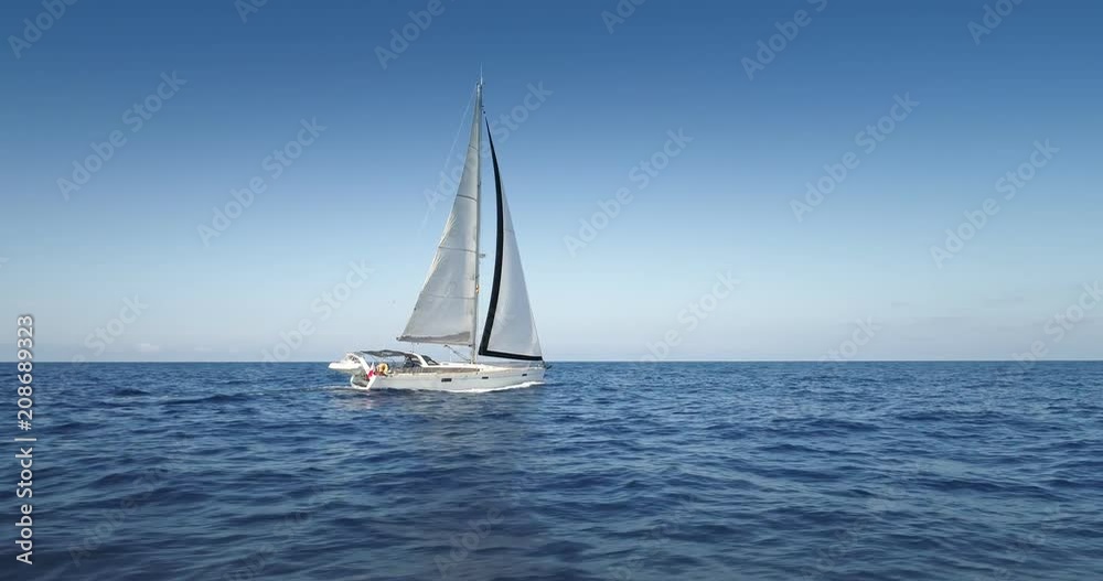 Yacht sailing at windy day. Freedom of Yachting at opened sea / ocean. Aerial, drone video. Yacht sailing at windy day. Freedom of Yachting at opened sea / ocean. Aerial, drone video.