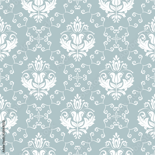 Classic seamless vector pattern. Damask orient ornament. Classic vintage light blue and white background. Orient ornament for fabric  wallpaper and packaging