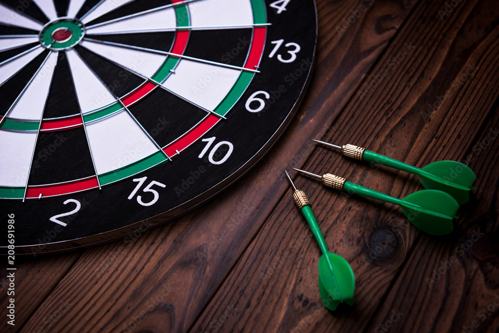 The darts on wooden background The darts on wooden background