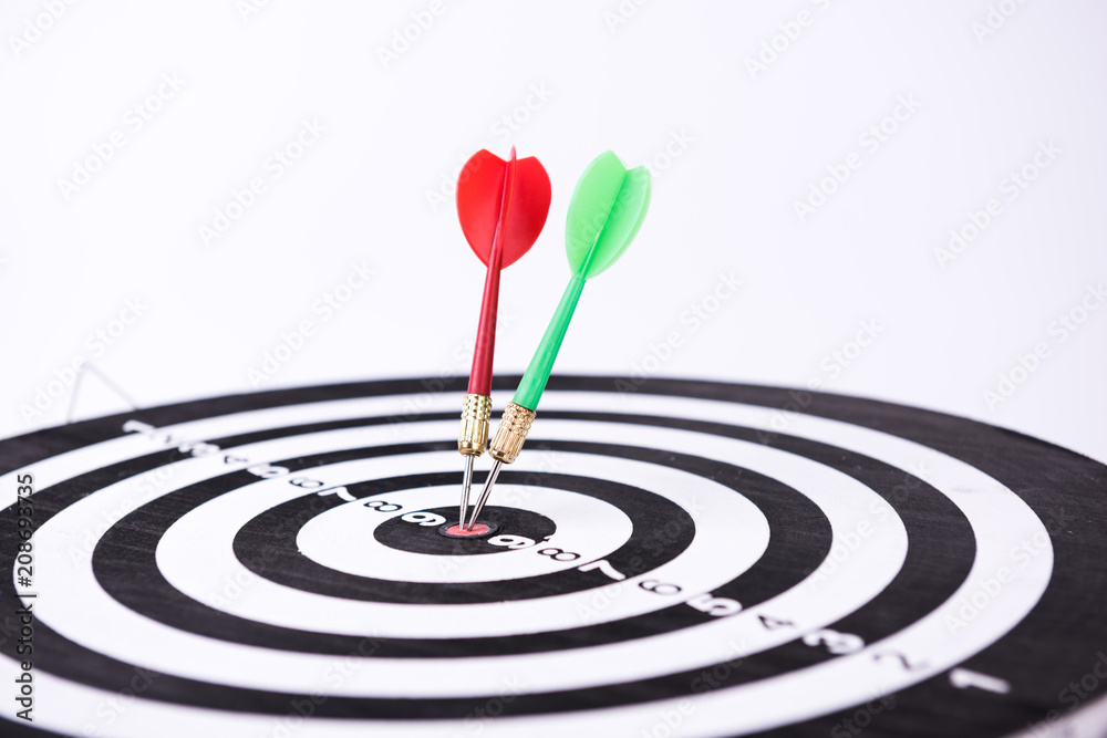 Dartboard with Darts Hitting the Bullseye Dartboard with Darts Hitting the Bullseye