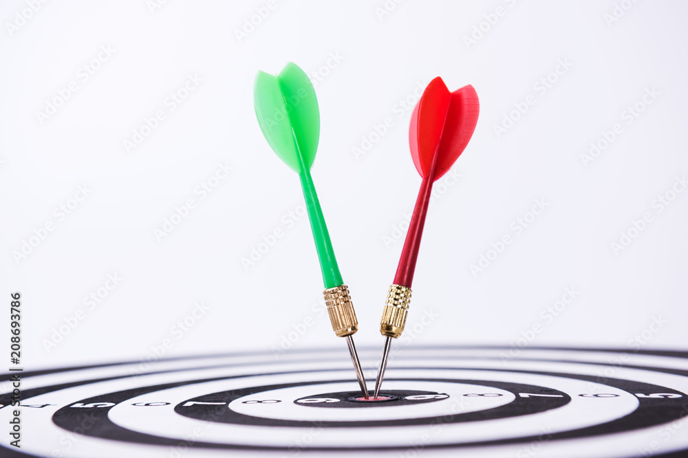 Dartboard with Darts Hitting the Bullseye Dartboard with Darts Hitting the Bullseye
