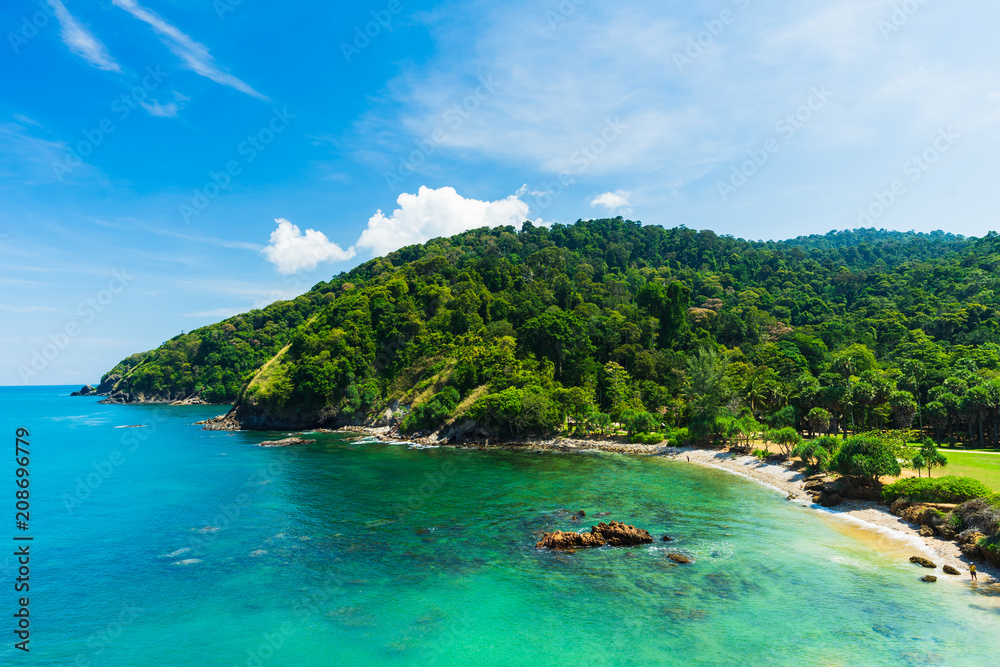 Summer seascape view with clear sea, green forest and blue sky on koh Lanta island in Thailand.