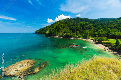 Summer seascape view with clear sea, green forest and blue sky on koh Lanta island in Thailand.