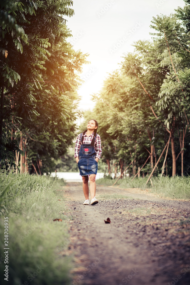 Beautiful girl walking in a summer forest. Beautiful girl walking in a summer forest.