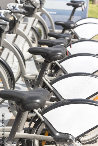 Wallpaper Mural Public bikes in a row in the Parking lot. Bicycle rental in the city Torontodigital.ca