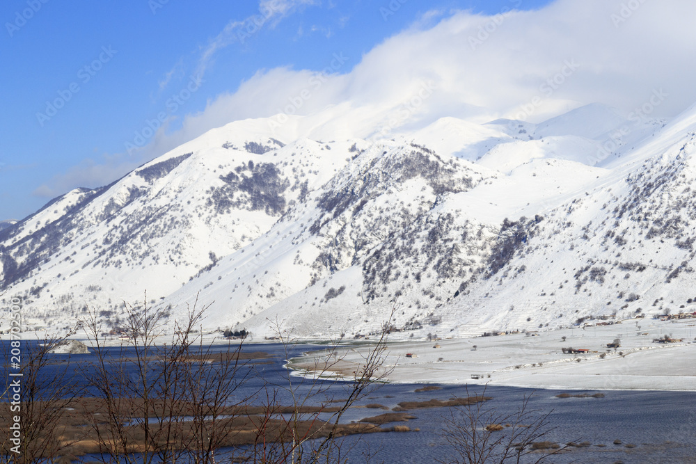 view of mountain lake with snow