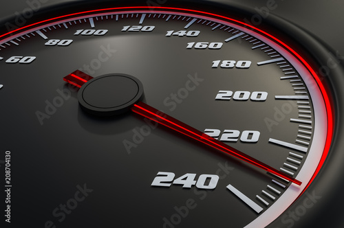 Red speedometer in car on dashboard