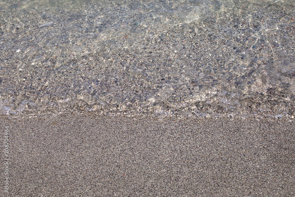 Water and sand close up in Monterosso, Liguria, Italy Water and sand close up in Monterosso, Liguria, Italy