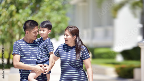 happy family of father, mother and sun in park . Insurance concept. © phonix_a