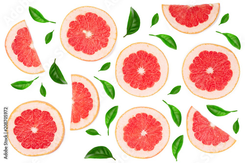 Grapefruit slices with leaves isolated on white background. Top view. Flat lay pattern