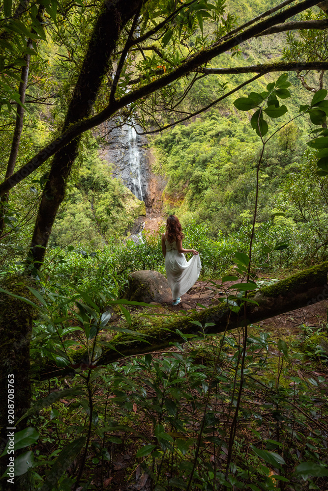 Girl watching the Cascade Blanche waterfall in Salazie, Reunion Island Girl watching the Cascade Blanche waterfall in Salazie, Reunion Island