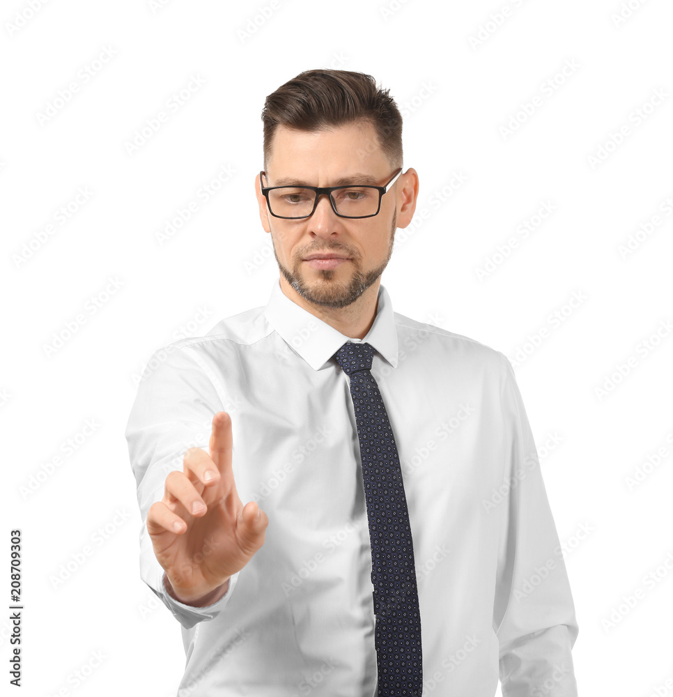 Young businessman using virtual screen on white background Young businessman using virtual screen on white background