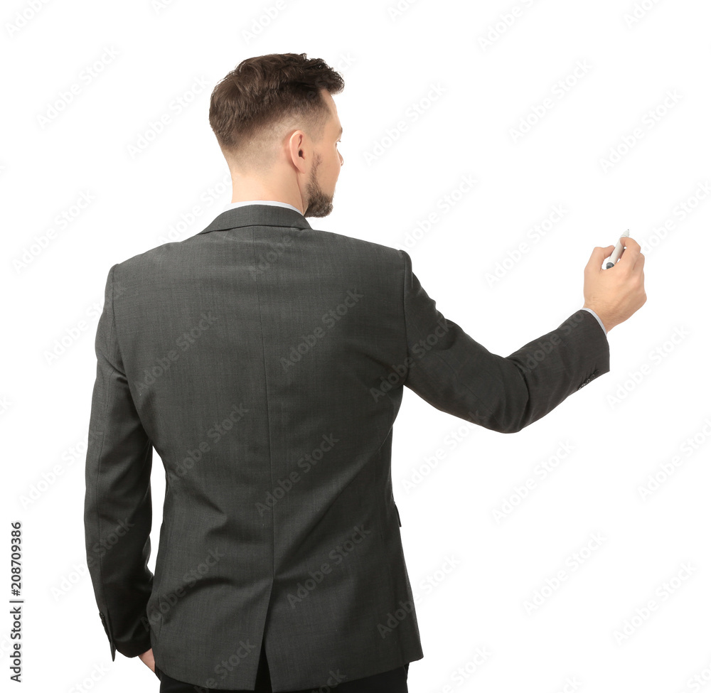 Young businessman writing on white background Young businessman writing on white background