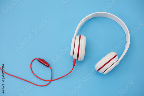 White headphones on blue background.